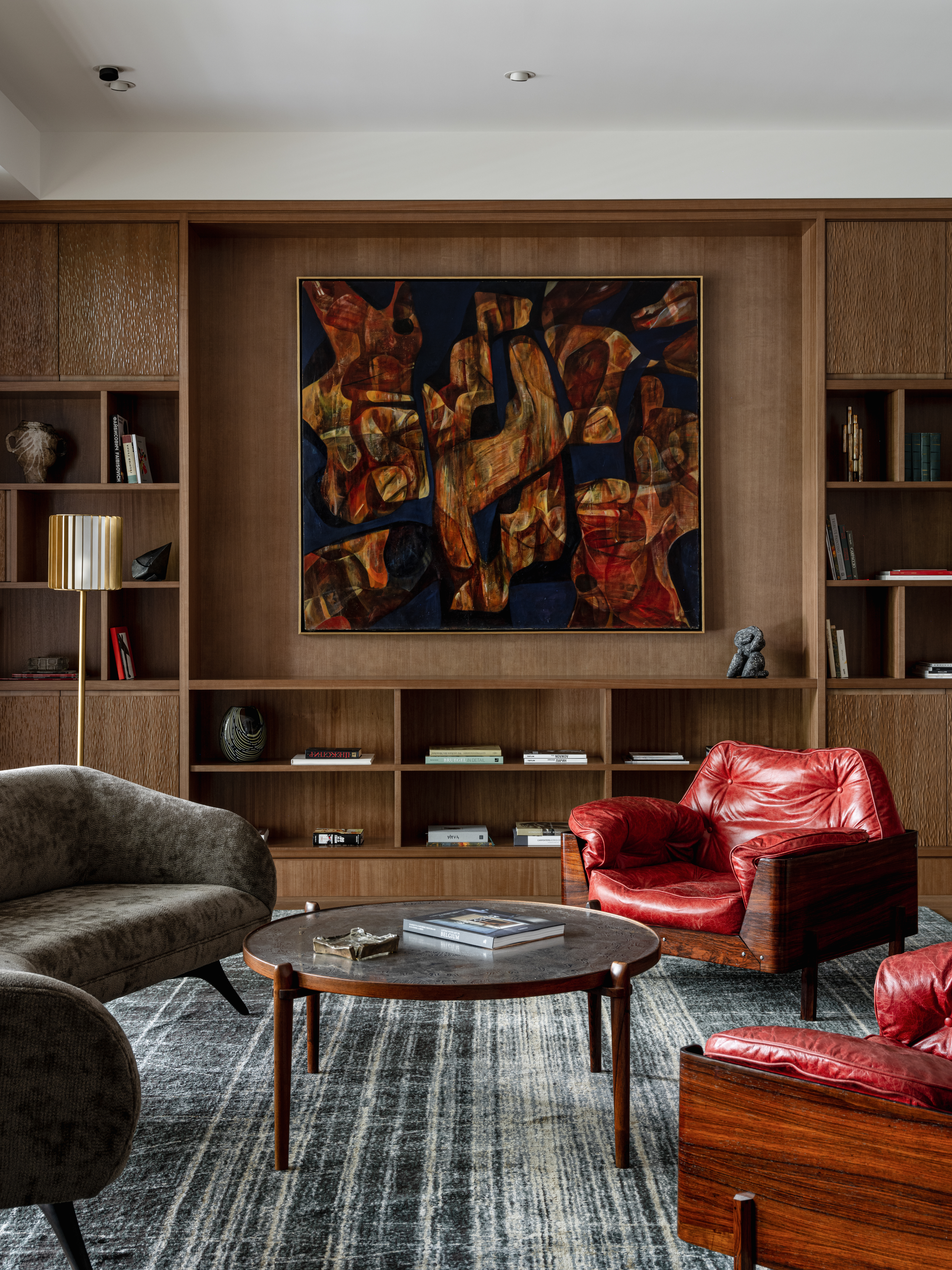 Stylized blue duotone portrait of a person facing the camera with arms crossed